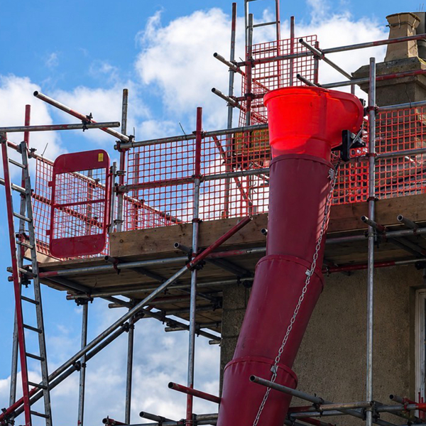 Scaffolding erected along roof with rubble shute - Scaffolding services in Paignton, Devon, by ACME Plus